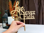 Load image into Gallery viewer, Love Never Fails Cake Topper
